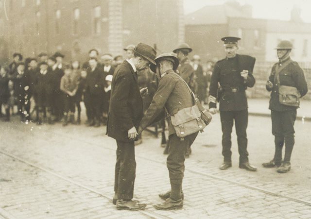 British military searching civilian, 1921