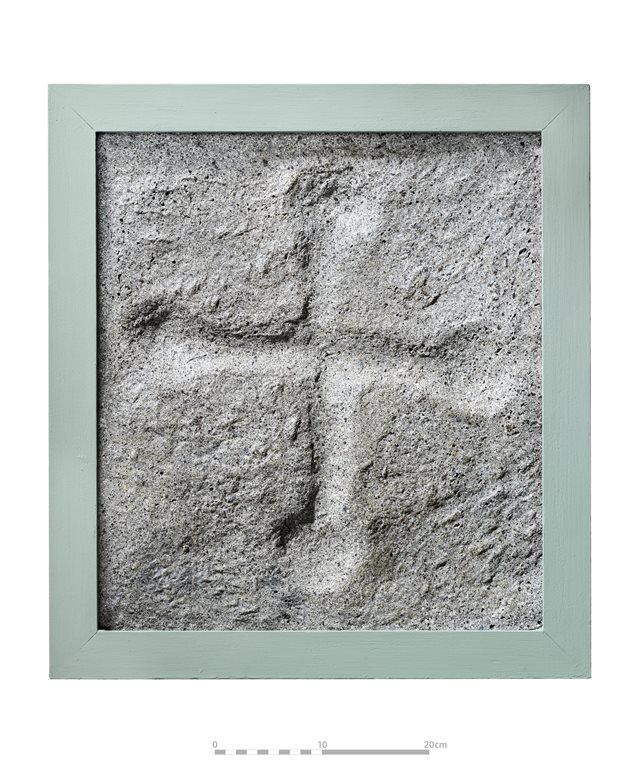 Concrete cast of cross-inscribed boulder